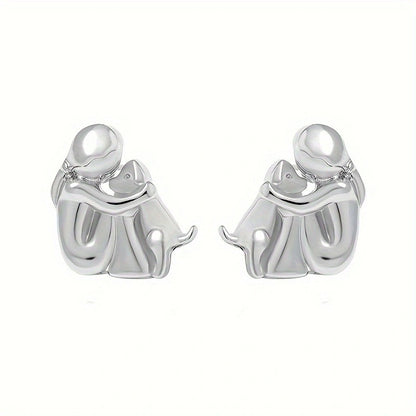 A little girl and a dog embrace earrings